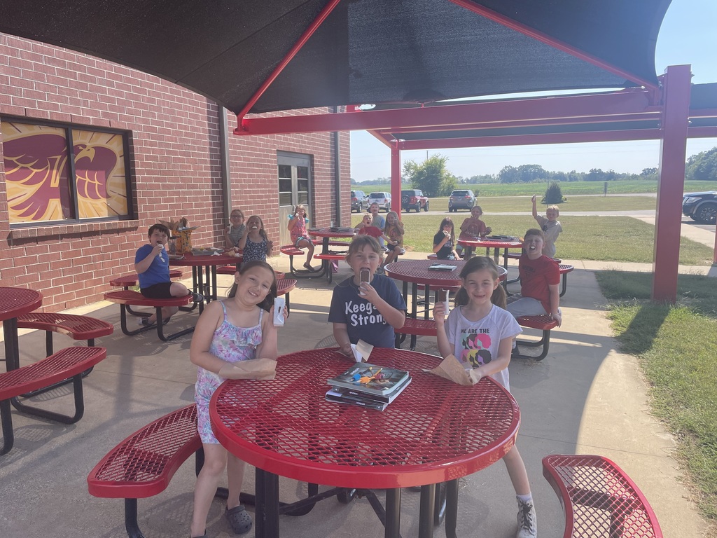 Students enjoying ice cream at the outdoor classroom